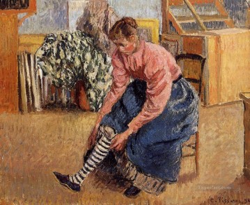  1895 Painting - woman putting on her stockings 1895 Camille Pissarro